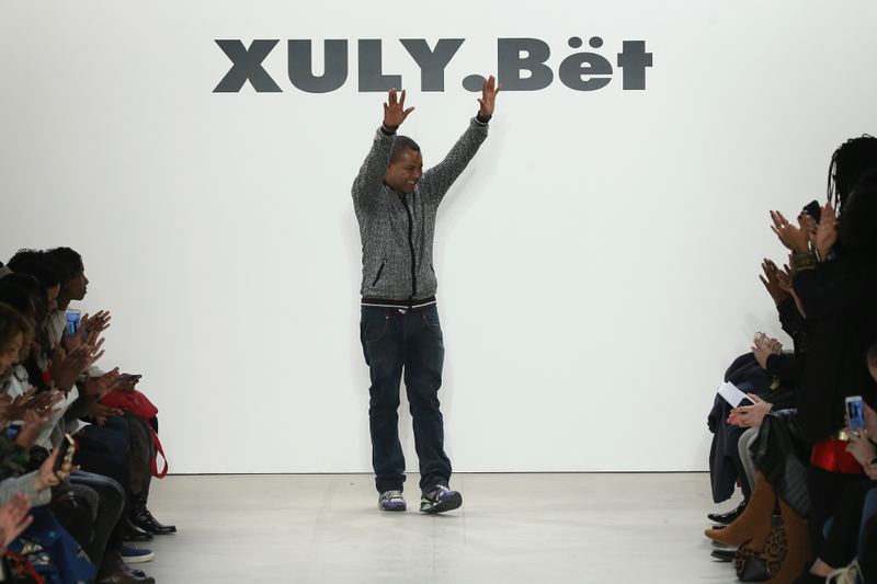 Man of the hour: Xuly.Bët designer Lamine Kouyaté waves from the runway during his fashion show in New York, Feb. 17, 2016. Neilson Barnard/Getty Images for NYFW: The Shows